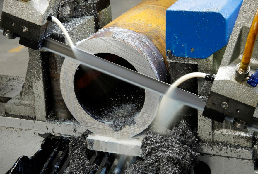 Bandsaw blade cutting pipe