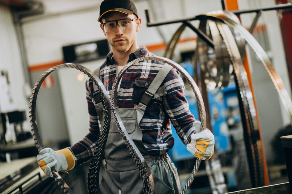 Man holding a bandsaw blade